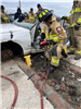 Firefighters Opening Damage Vehicle