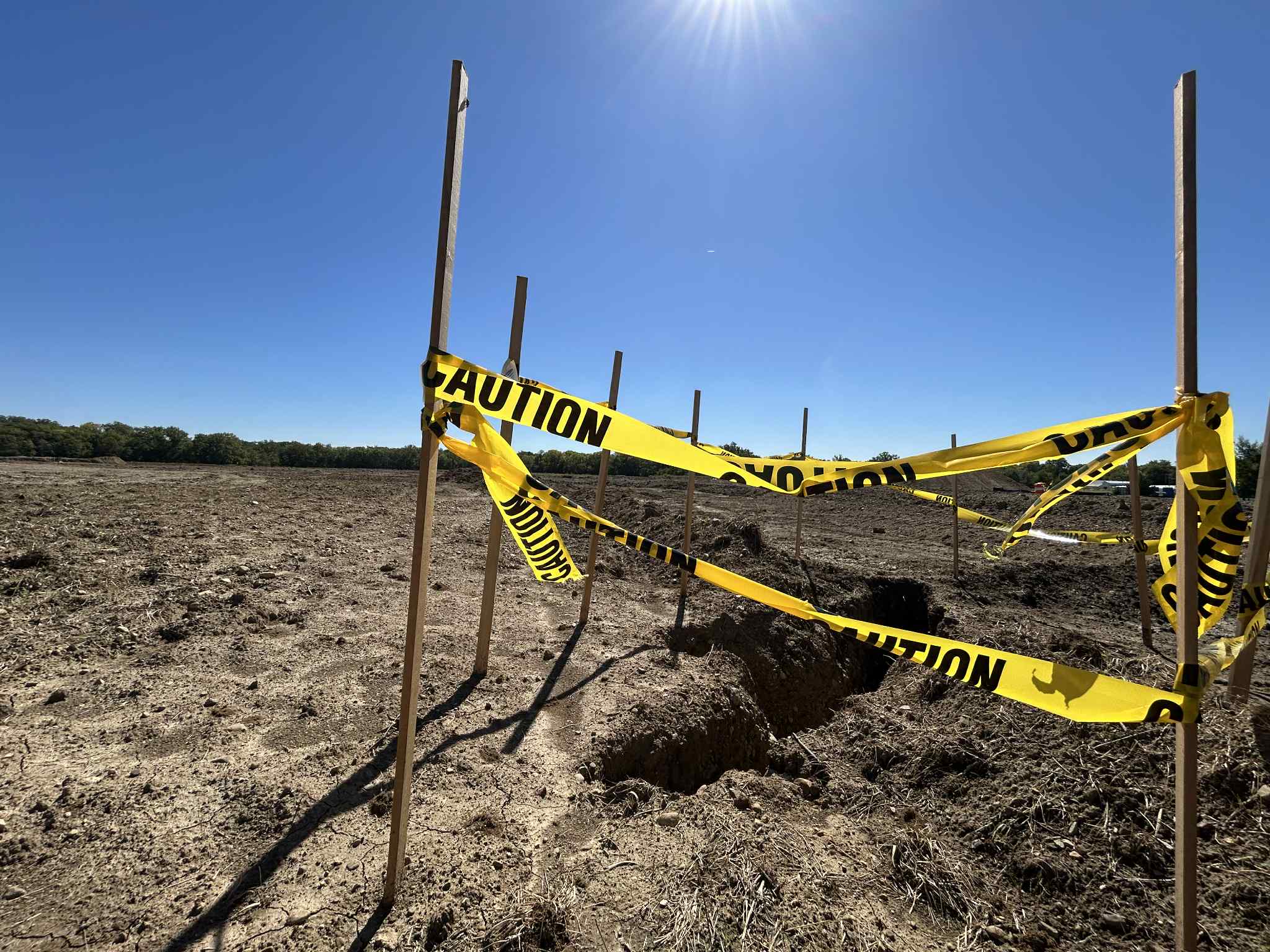 Close up picture of construction site and tape on a sunny day at Blue River Memorial Park